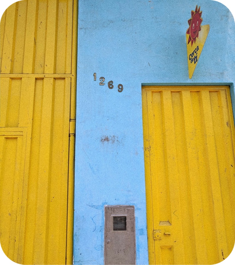 D'Onofrio storefront painted in yellow and blue